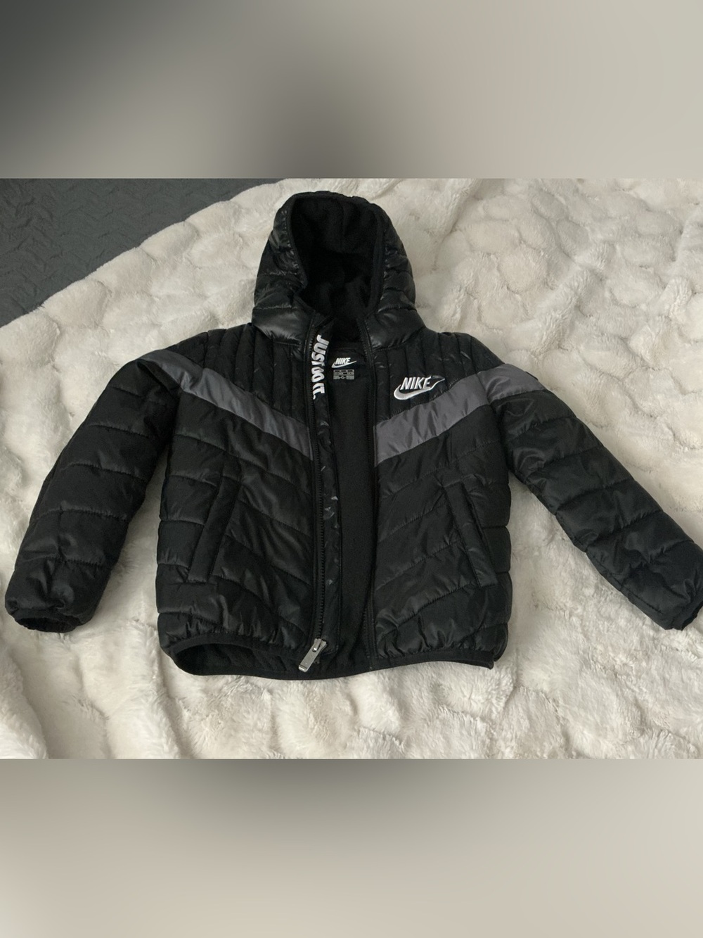 Nike Kids Black Puffer Jacket with Gray Chevron Accent